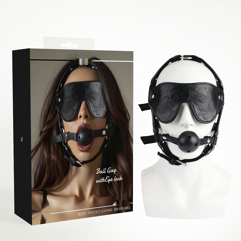 Black adjustable ball gag and blindfold set displayed with retail packaging on a mannequin head