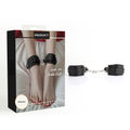 Black padded ankle cuffs with silver metal chains, shown next to their retail packaging box on a white background.