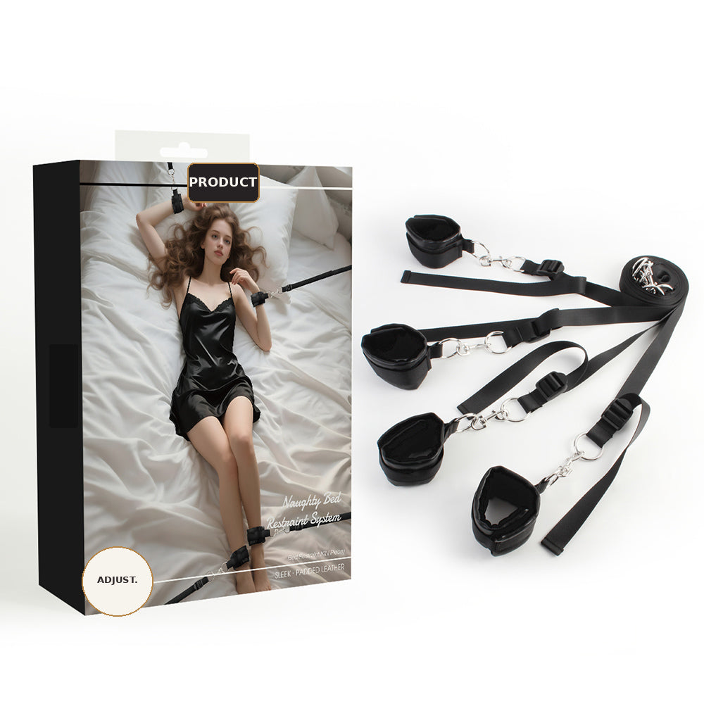Black under-bed restraint system with cuffs, straps and silver hardware beside product packaging