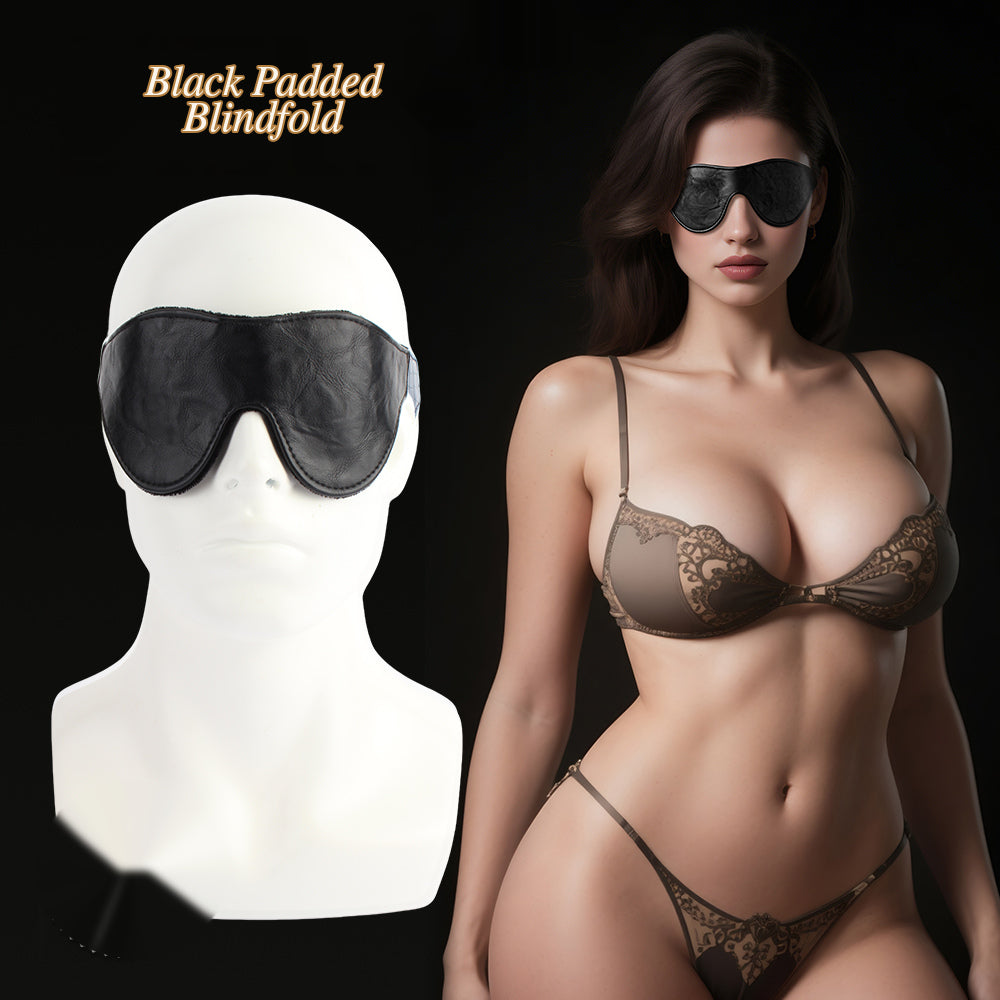 Black padded blindfold shown on a white mannequin head and worn by a model in brown lace lingerie against a black background, with the text 'Black Padded Blindfold' at the top.