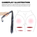 A black leather flogger with a silver handle is shown being held by a hand, next to an instructional diagram of a female body with red highlighted areas indicating punishment zones. The text at the top reads 'GAMEPLAY ILLUSTRATION' with additional explanatory copy.