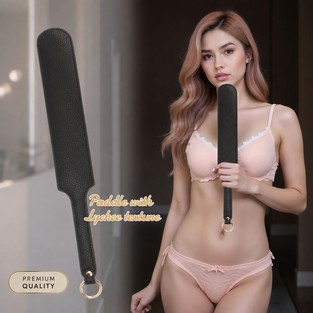 A woman in a light pink lingerie set holds a black textured paddle with a gold ring handle, shown alongside a larger close-up of the paddle on the left. Text on the image reads 'Paddle with Lacey texture' and 'PREMIUM QUALITY'.