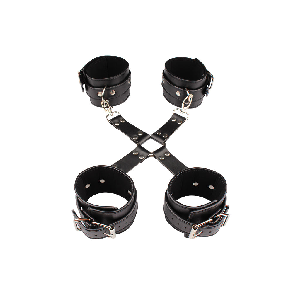 Black four-cuff restraint set with cross connector included in the beginner BDSM bondage kit