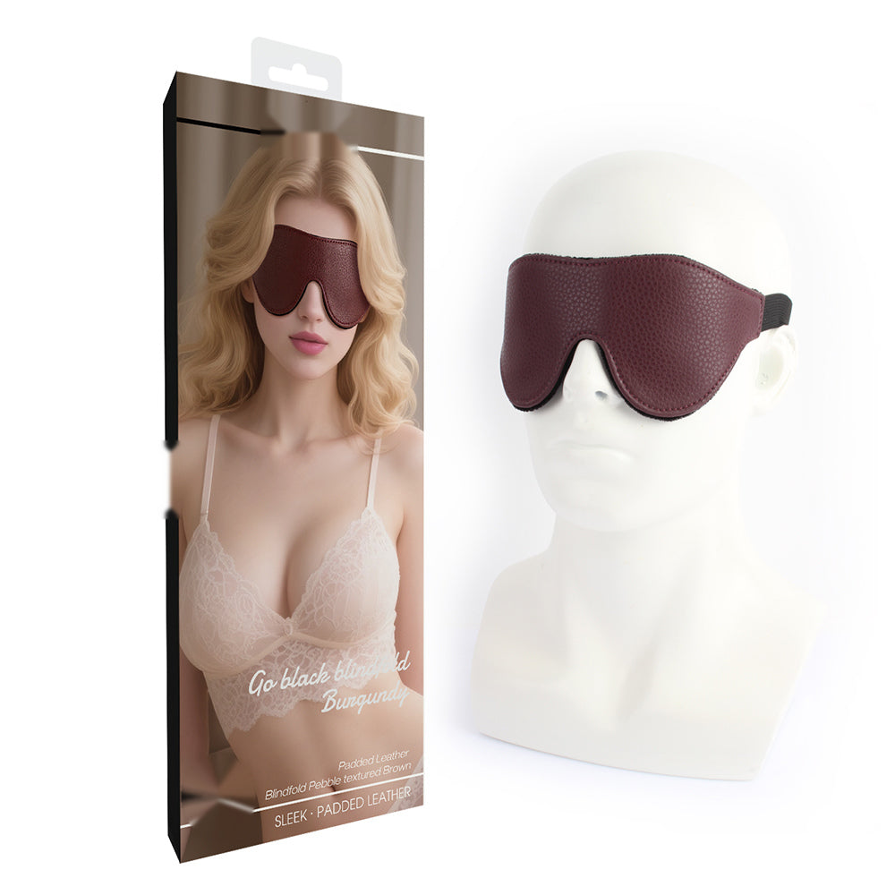 Burgundy padded blindfold shown with retail packaging and product display