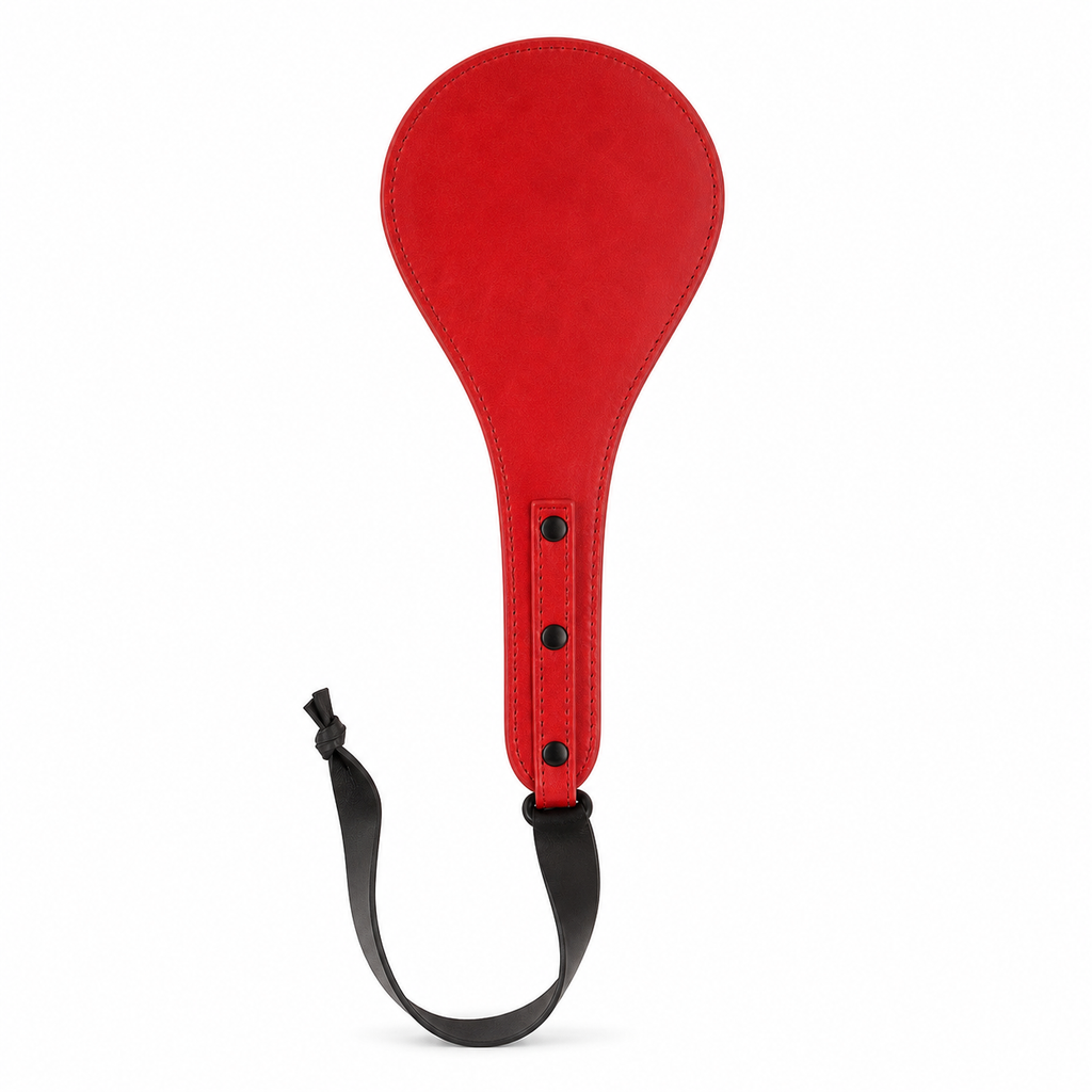 Red round leather paddle with three black rivets and a black wrist strap on a clean white background.